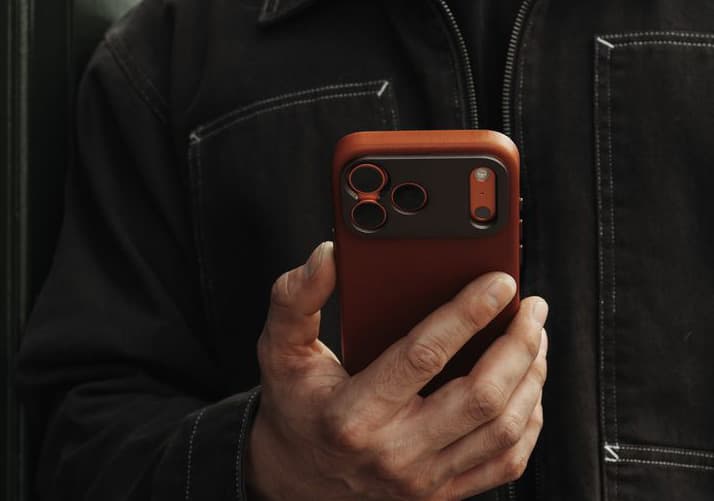 A customer holding a phone