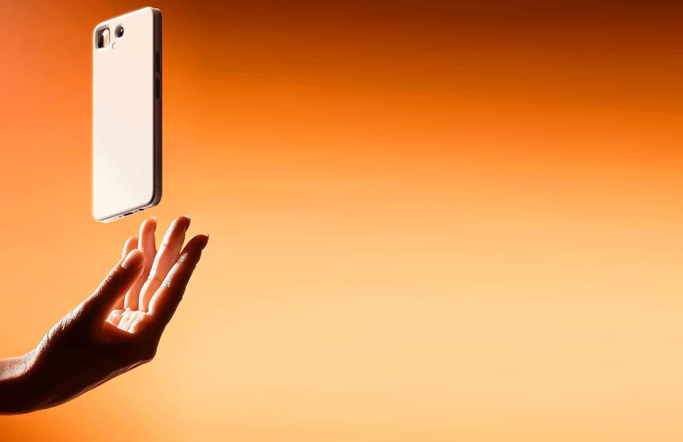 A phone above an open hand